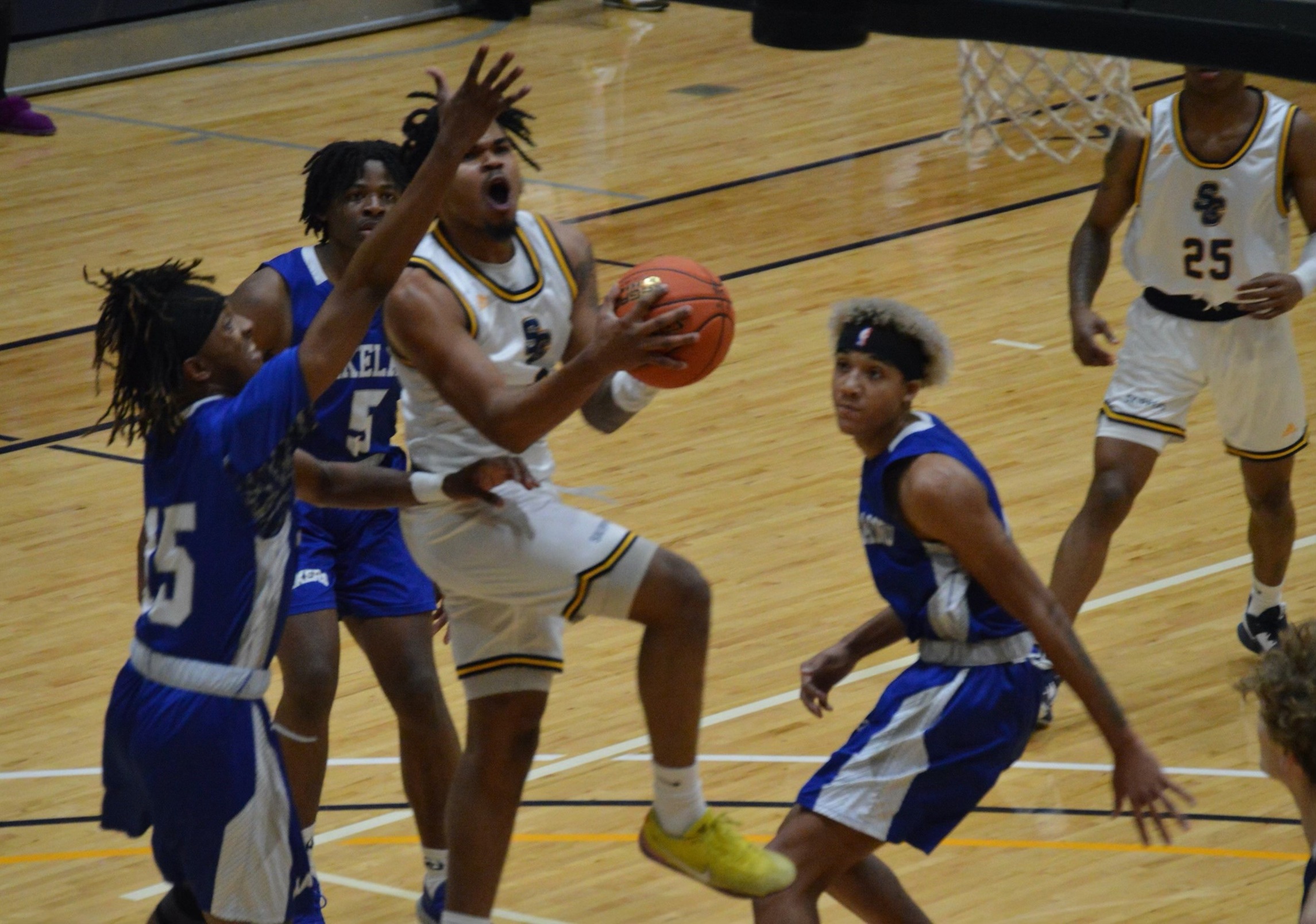 Sophomore guard Caron Clayton attacks the rim vs the Lakeland Lakers in an early season matchup at the SC4 fieldhouse.