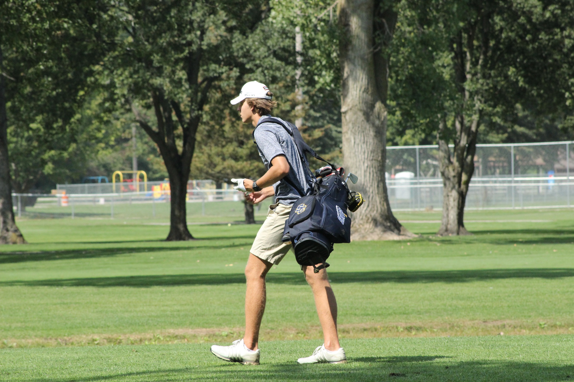 SC4 golfer walking with bag 