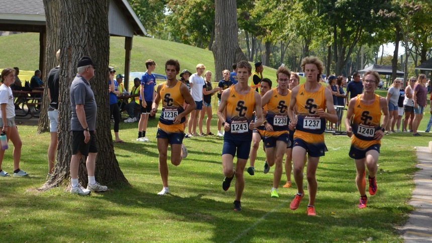 Men's cross country team running at the skippers invite 