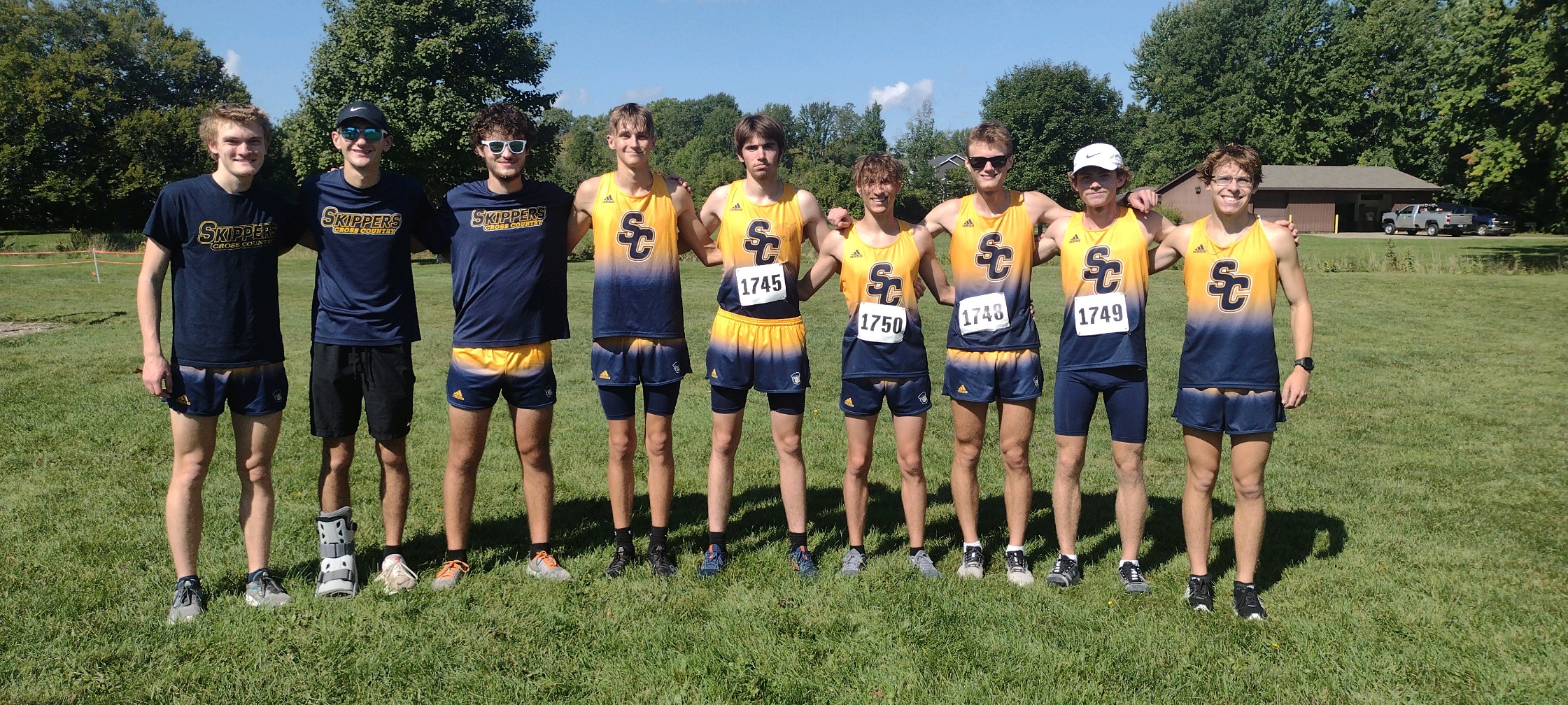 2023 sc4 men's cross country team before their race at GRCC
