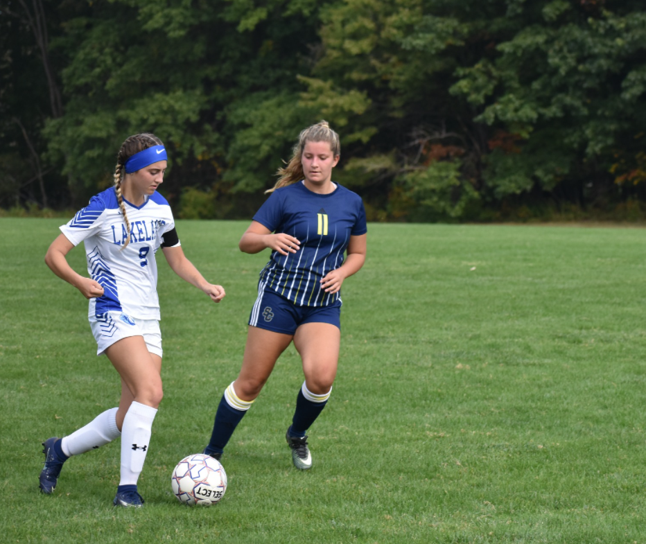 Women's Soccer player from Sc4 trying to steal the soccer ball 