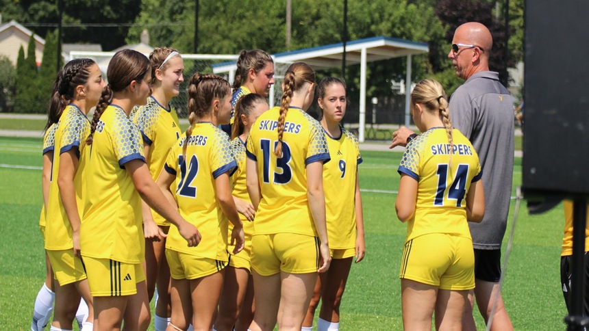2023-2024 soccer team in a huddle