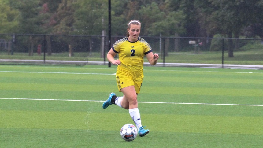 Colleen Kubisiak dribbling a soccer ball against terra state 