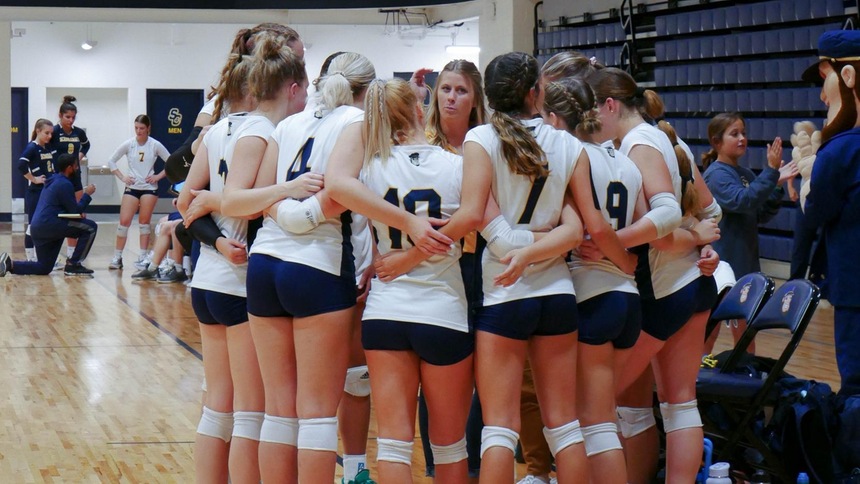 Skippers Volleyball in a team huddle 