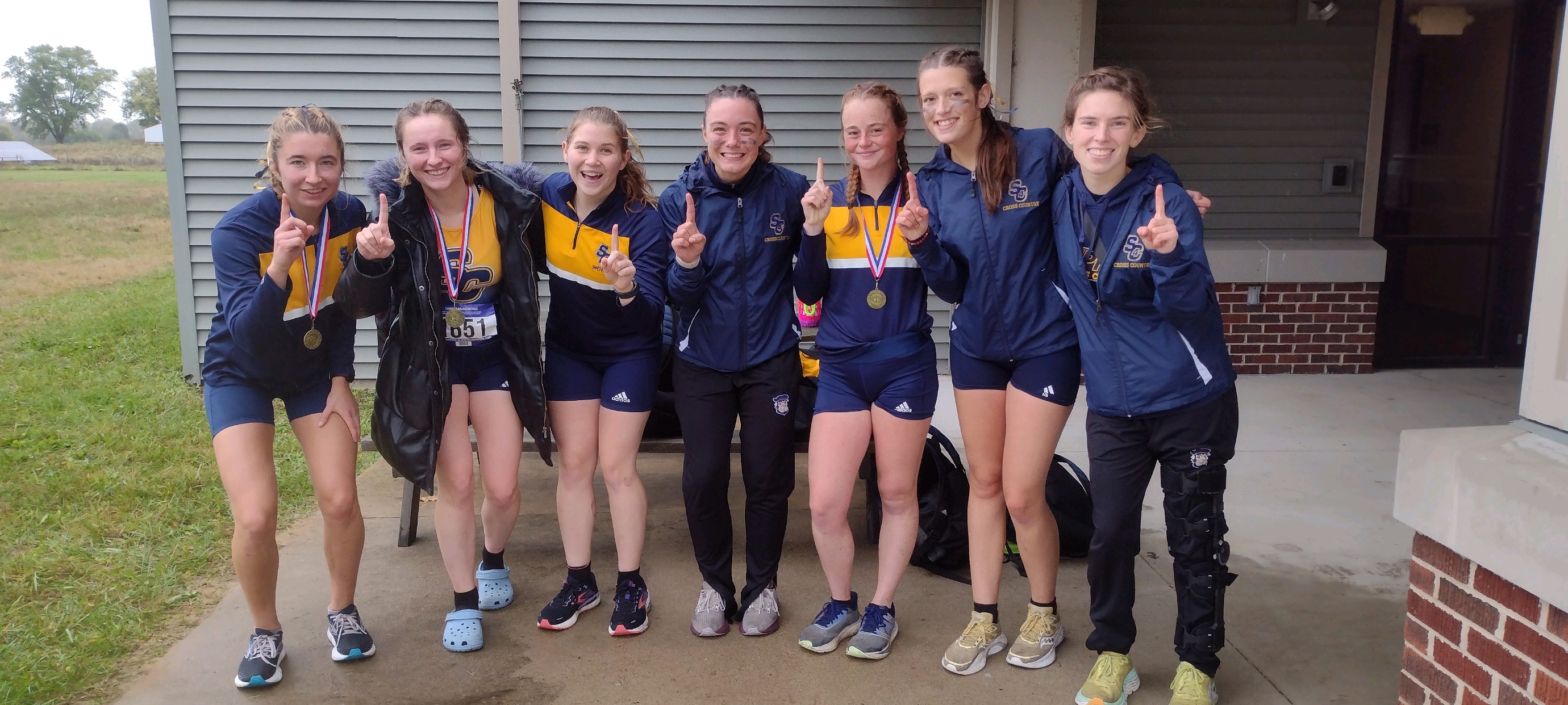 2023-24 xc team together after their race at ancila 